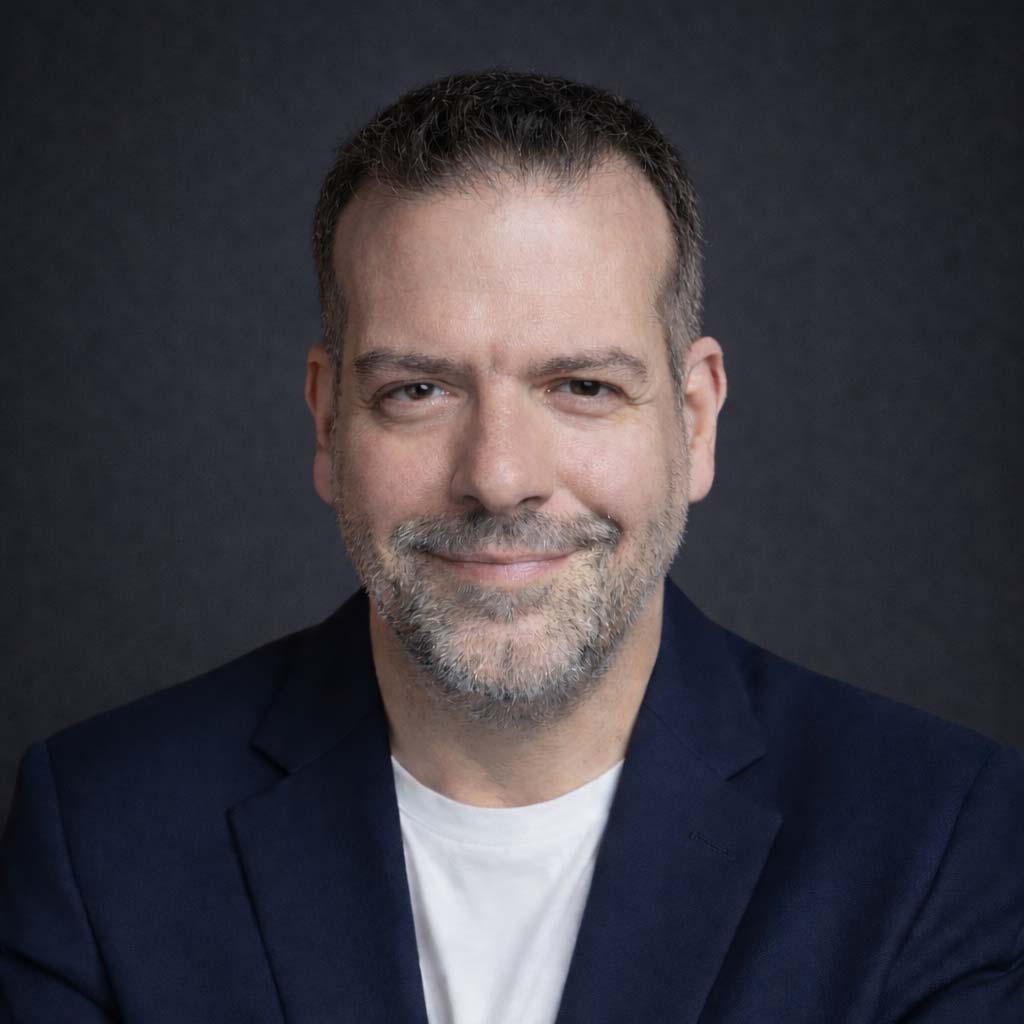 Portrait of Jean-Luc Benazet, founder of MadlyWed and seasoned UK wedding photographer